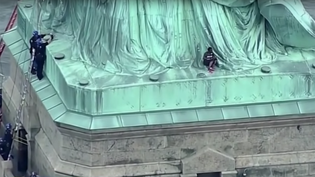 A Woman Climbed The Statue Of Liberty On The Fourth Of July To Protest ...